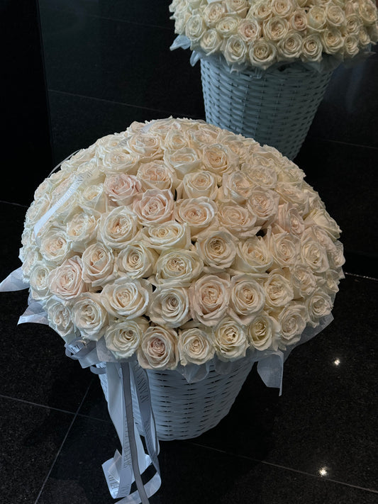 A basket of white roses