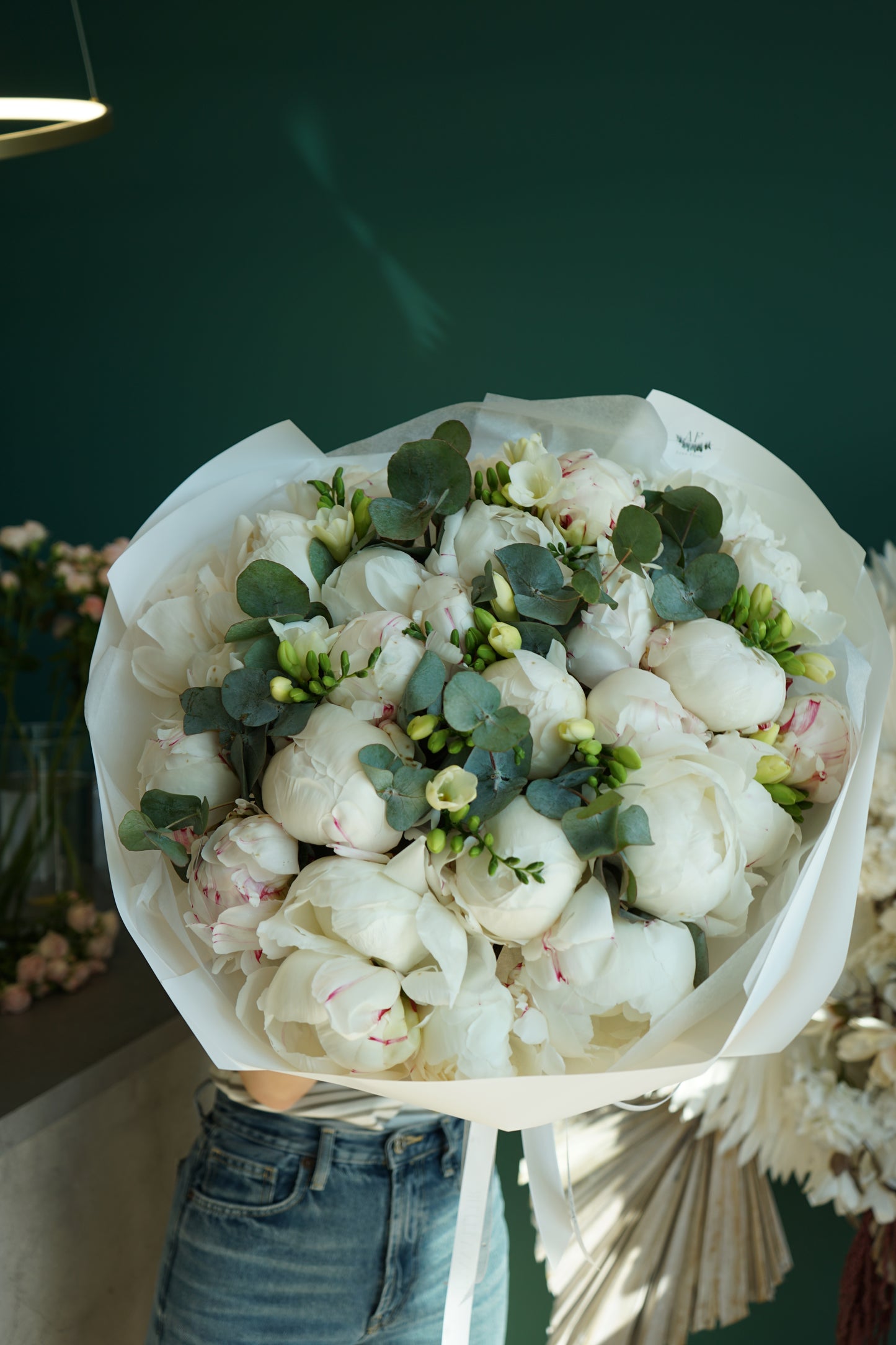 Bouquet of peonies eucalyptus and freesias