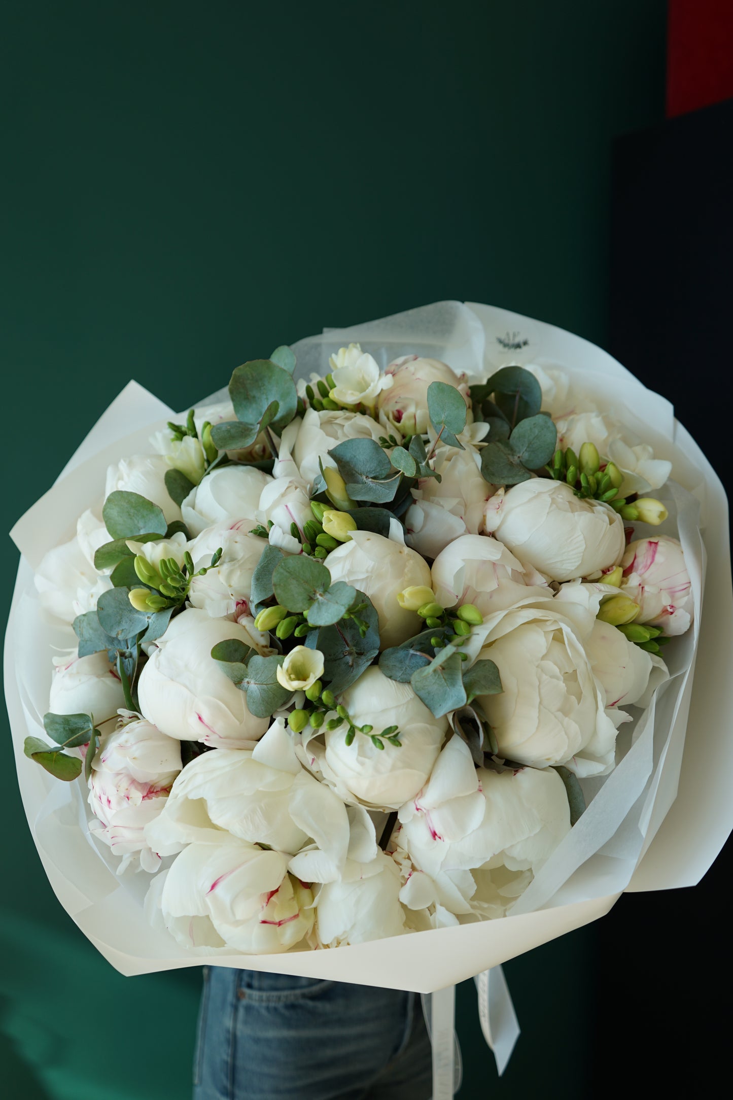 Bouquet of peonies eucalyptus and freesias